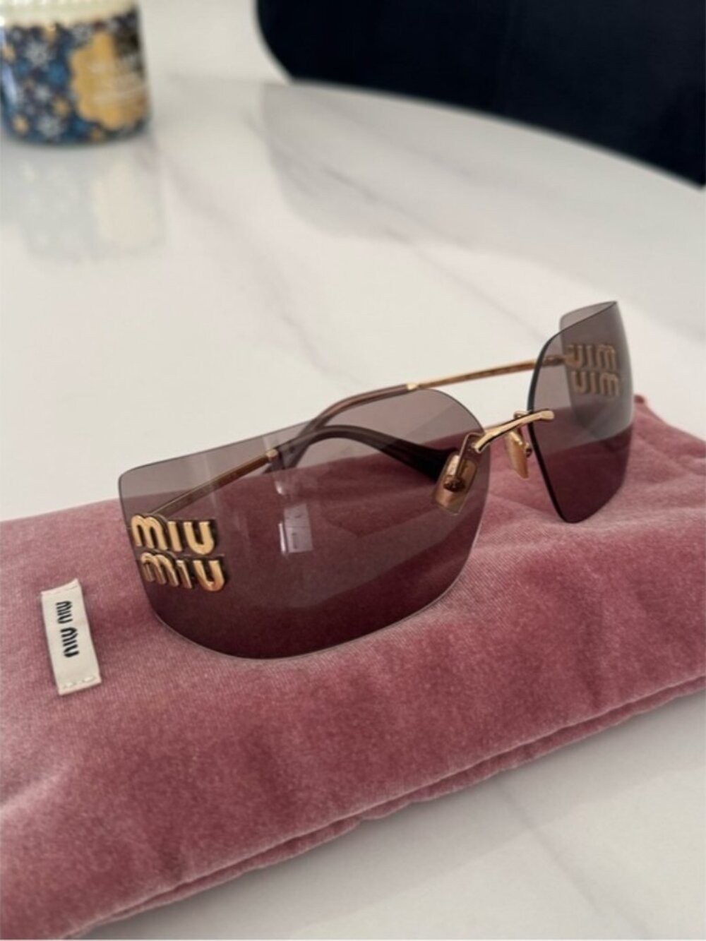 Miu Miu Rimless Sunglasses with Plum Lenses and Gold Accents